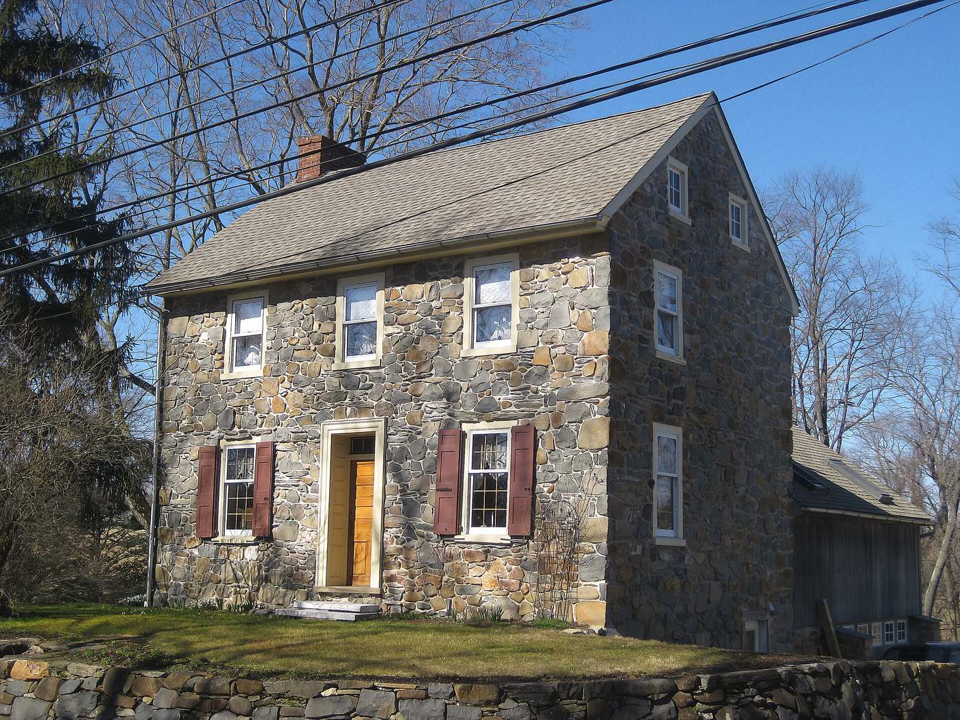 A stone farmhouse on West Strasburg Road, West Bradford Township. Two feet of fieldstone, a roof that has been done twice, and a kitchen somebody put in around 1974.