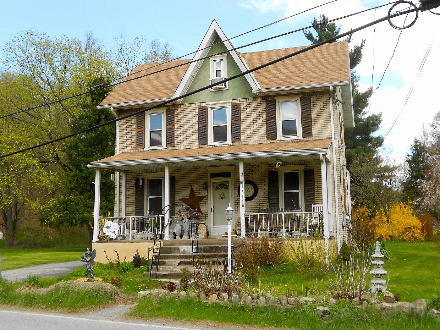 A house in Modena, the small borough just south of South Coatesville. Wraparound porch, gable trim, and a mill town's prices.